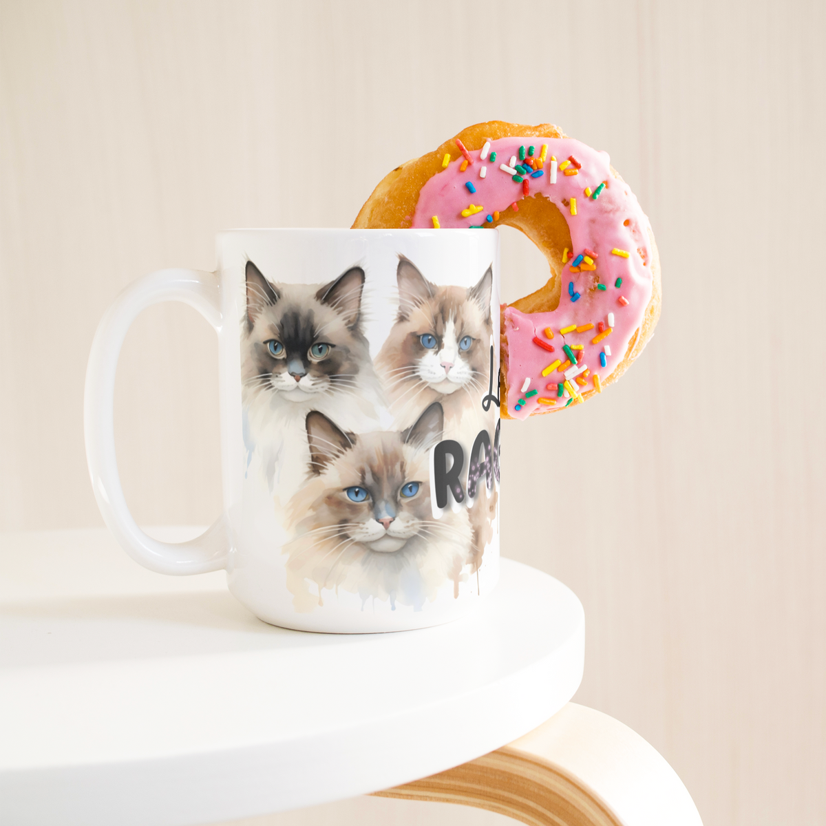 Love_Ragdoll_15_Oz_White_Coffee_Mug_15ozWhiteMugLifetsyleDonutLH_Mockup.png